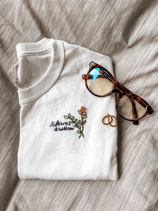 A white crewneck that features the phrase 'life was a willow'.