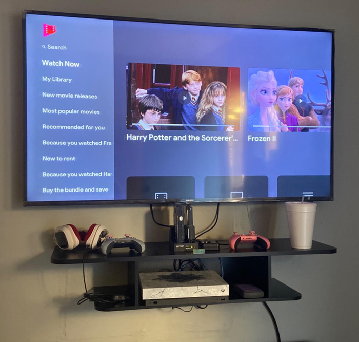 Reviewer image showing a TV placed on a black stand