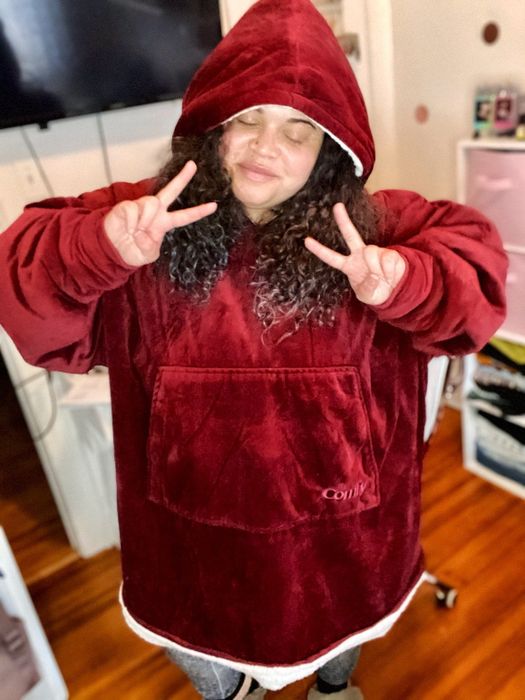 Mytour editor lounging in the comfy sweatshirt in burgundy