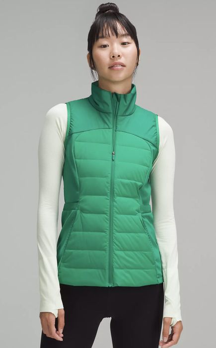 a model showcasing the green puffer jacket