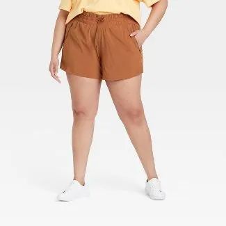 another model showcasing chestnut-colored shorts