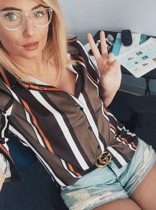 A reviewer showcasing the blouse