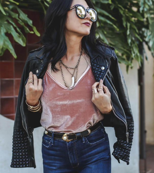 reviewer rocking the cami in pink paired with a leather jacket and jeans