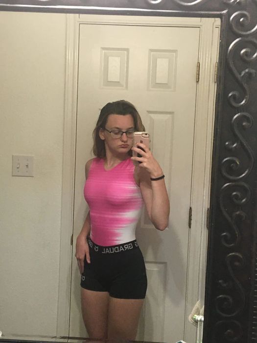 a reviewer pictured wearing the compression shorts