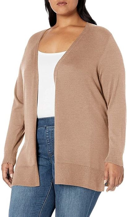 A model sporting the cardigan in camel, teamed with jeans and a white tank top.