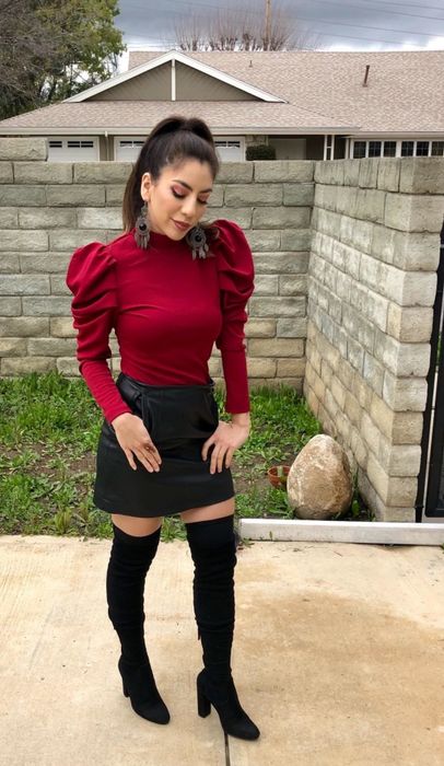 A reviewer is wearing the top in red.