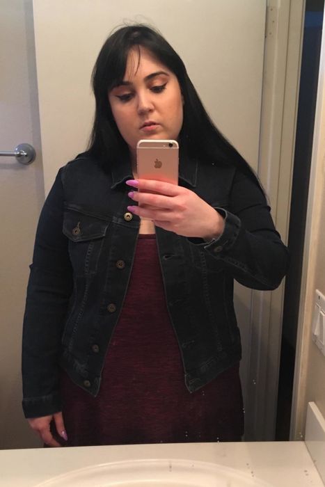 reviewer sporting the jacket in a rich dark denim shade.