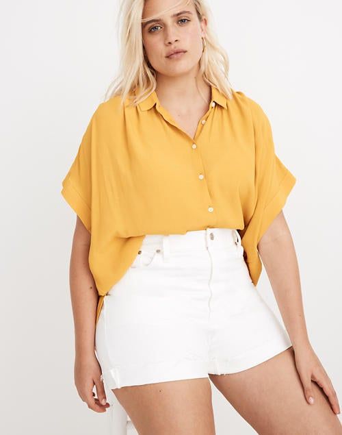 A front view of a model showcasing the shirt in yellow.