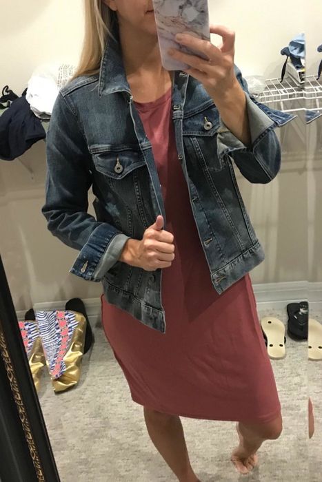 reviewer rocking the jacket in a medium wash denim style.