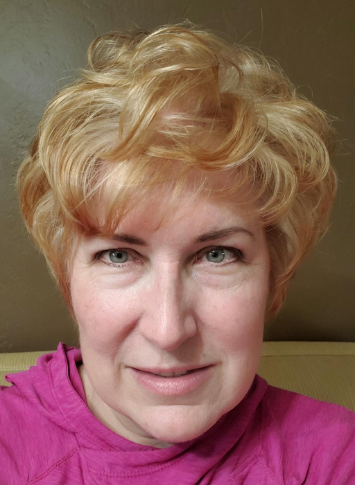 The same reviewer, now with hair that looks more voluminous and textured