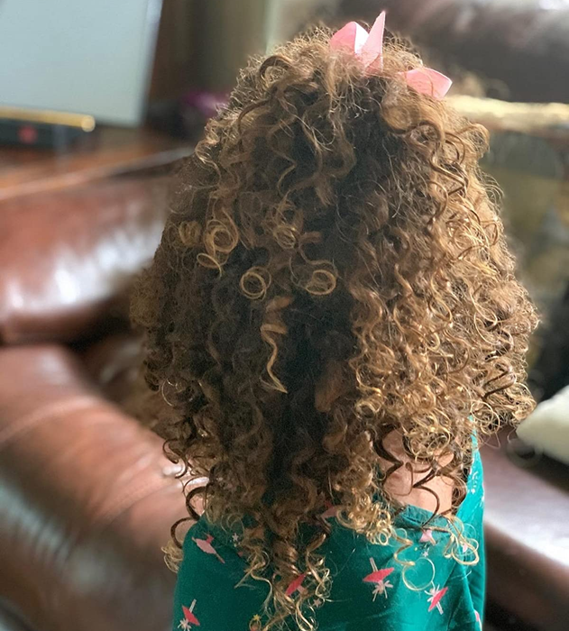 An image of a reviewer's child's curly hair.