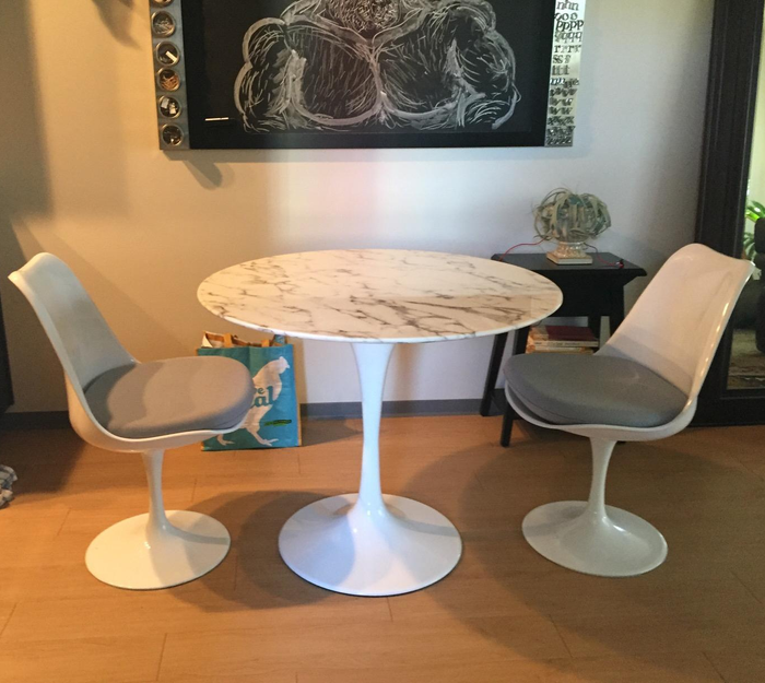 Customer image showing the 36-inch white table with a marble top