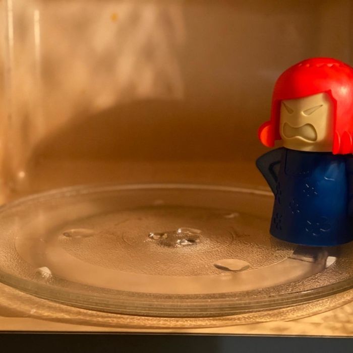 A photo of the Angry Mama inside the same microwave, now much cleaner, shared by the reviewer.