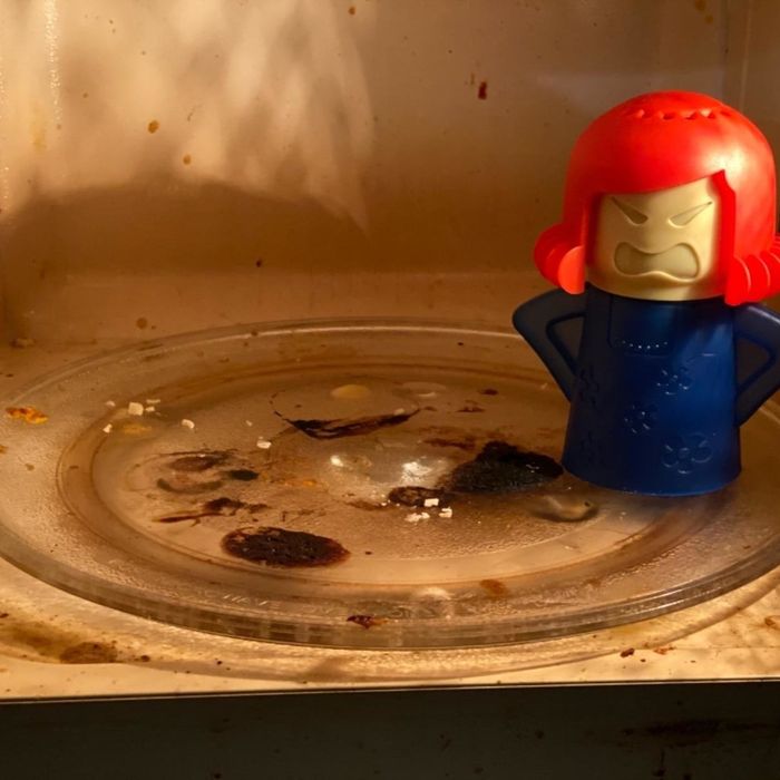 A photo of the Angry Mama inside a dirty microwave, as shared by the reviewer.