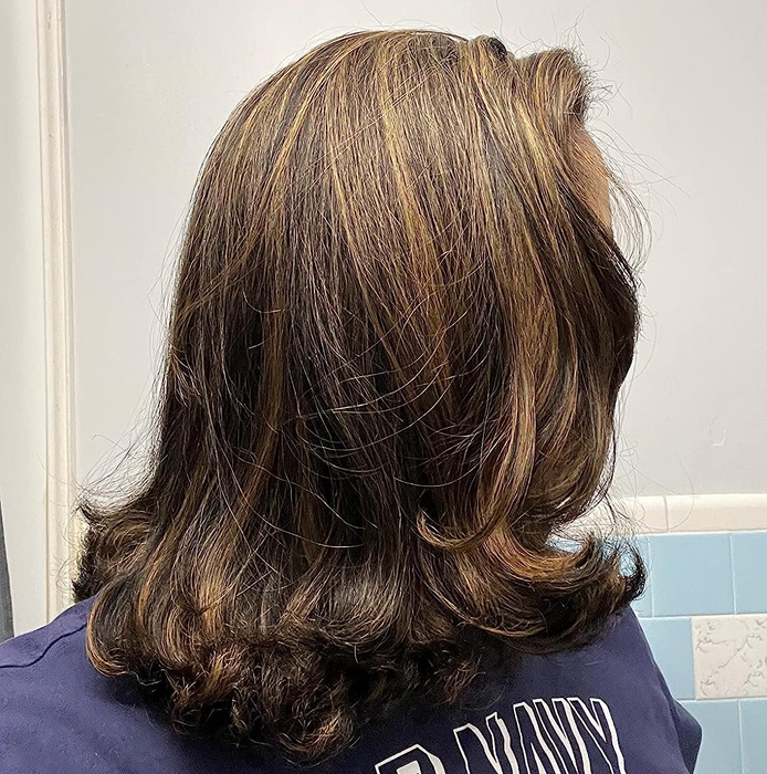 Image of the same reviewer with dry, sleek, straight hair.
