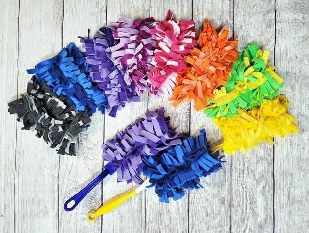 Swiffer heads made from cut-up fleece fabric in various color combinations.