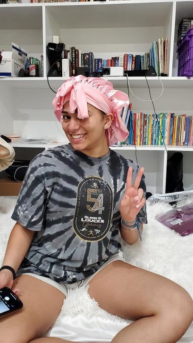 Customer posing with the pink satin bonnet