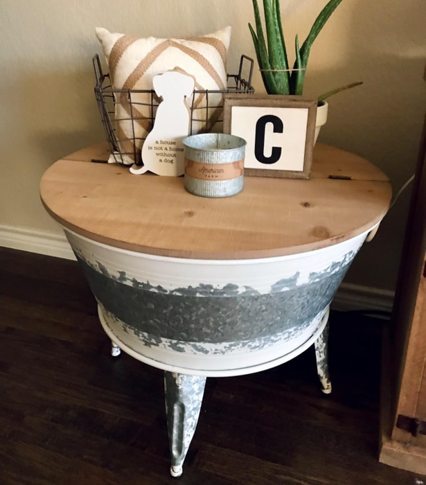 Customer photo of the coffee table featuring an aloe vera plant, a candle, and other items arranged on top