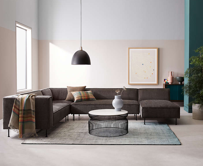 Image of the marble coffee table placed next to a couch in a living room