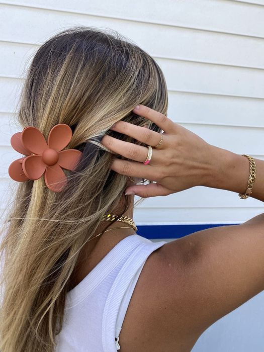 Customer wearing the tan floral clip in their hair