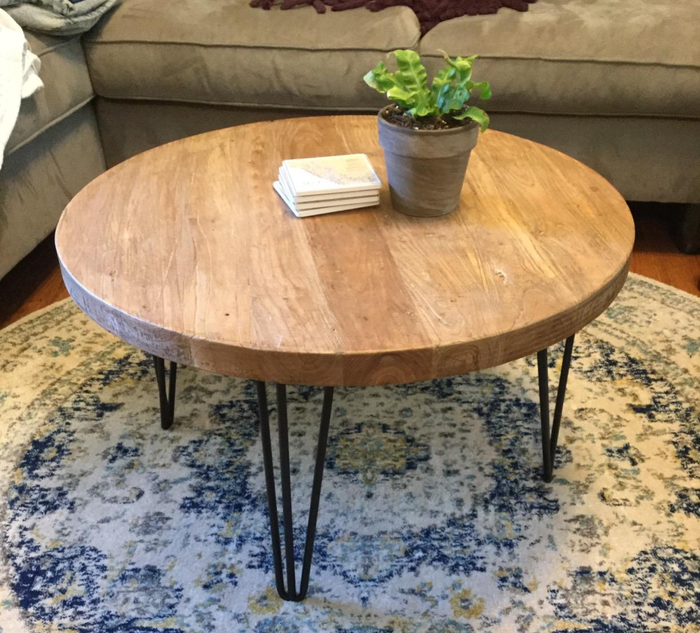 Customer photo of the brown round wood coffee table with a plant placed on top