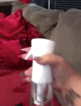 A gif showing a reviewer using the spray bottle.