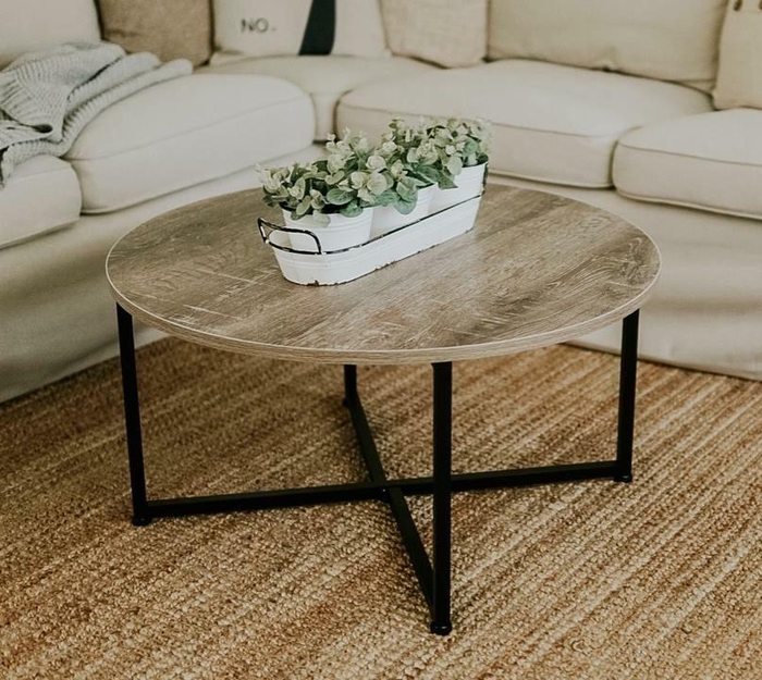 Customer photo showing the coffee table adorned with plants