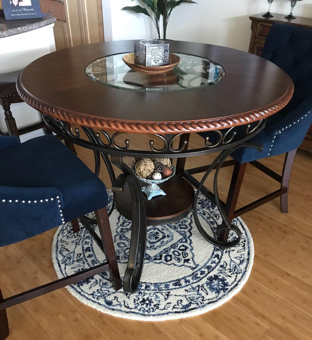 Reviewer image of the brown table with two blue chairs