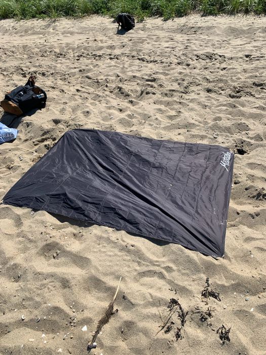 Matador blanket spread out on the beach