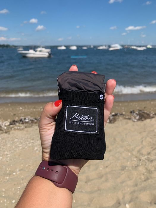 writer holding a Matador blanket in their hand