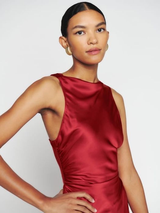 a close-up of the red dress's high neckline