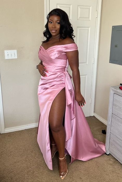 A reviewer showcasing the dress in pink.