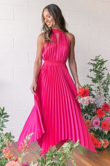 a model posing in hot pink