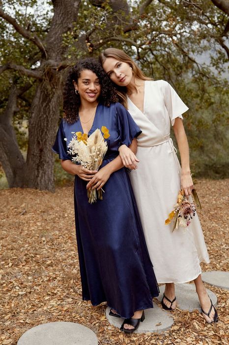 Two models posing in navy and white.