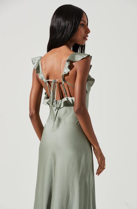 a close-up shot of the green dress featuring ruffled straps at the back