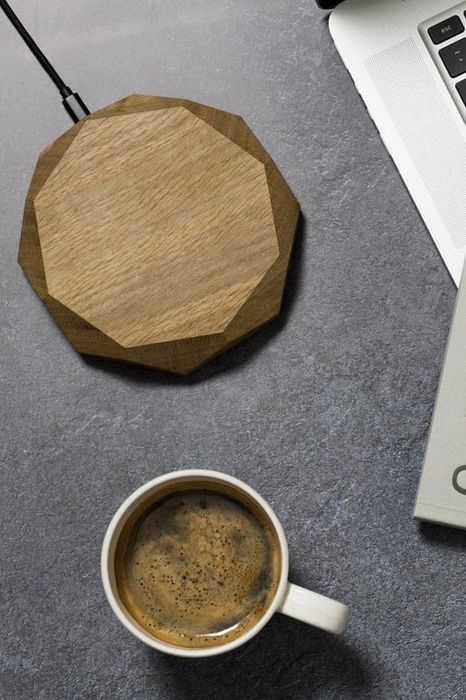 a bird's-eye view of the charger accompanied by a cup of coffee