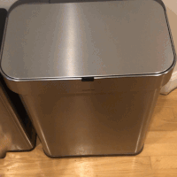 A gif of an editor waving their hand over the garbage can, causing it to open automatically.