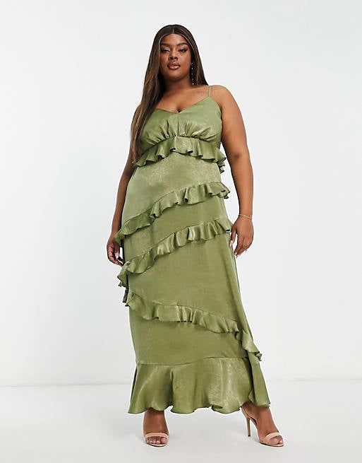 a model showcasing the green dress with five layers of ruffles