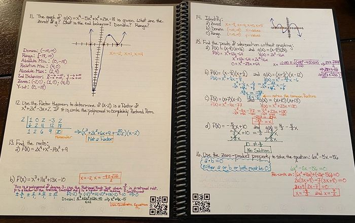 A reviewer's photo of the open notebook, filled with notes and showing small QR codes in the bottom corner of each page