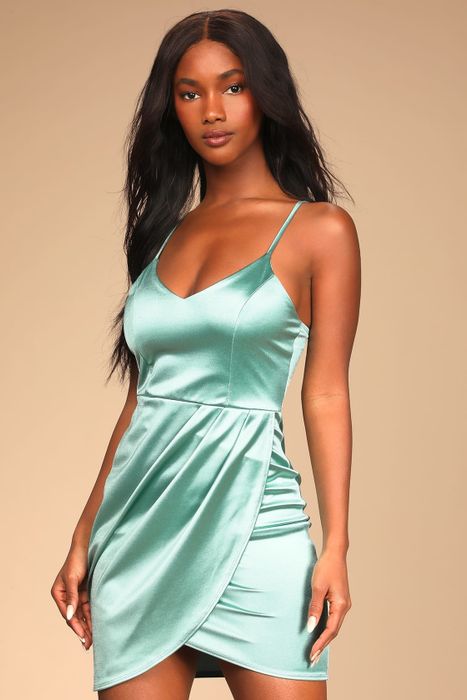 a model sporting the mint version of the dress