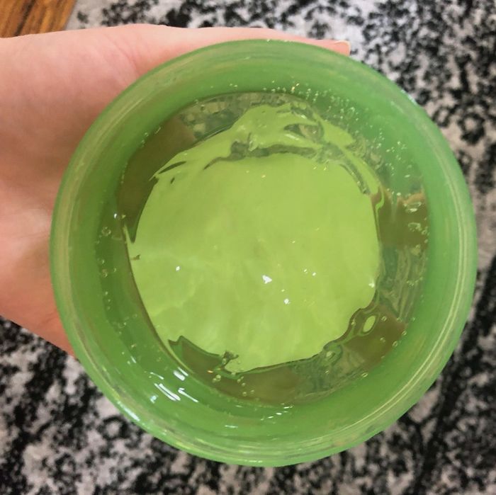 An open jar of aloe vera gel.