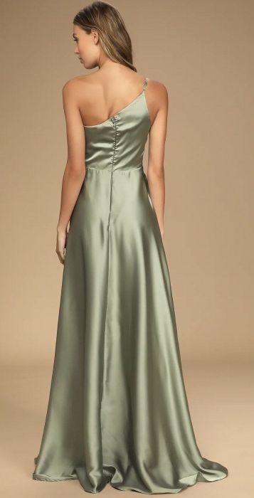a back view of a model wearing the dress in green