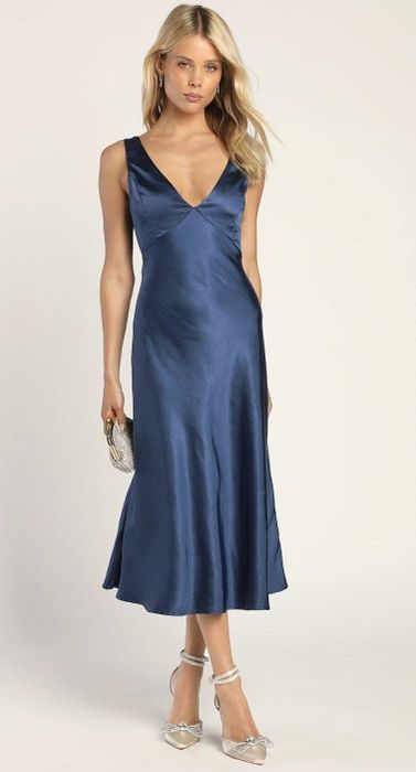 a model wearing the dress in navy blue