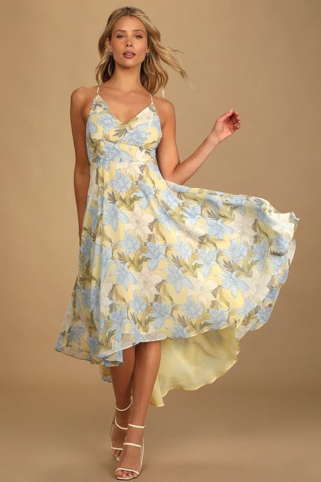 a model wearing the dress in a combination of yellow and blue