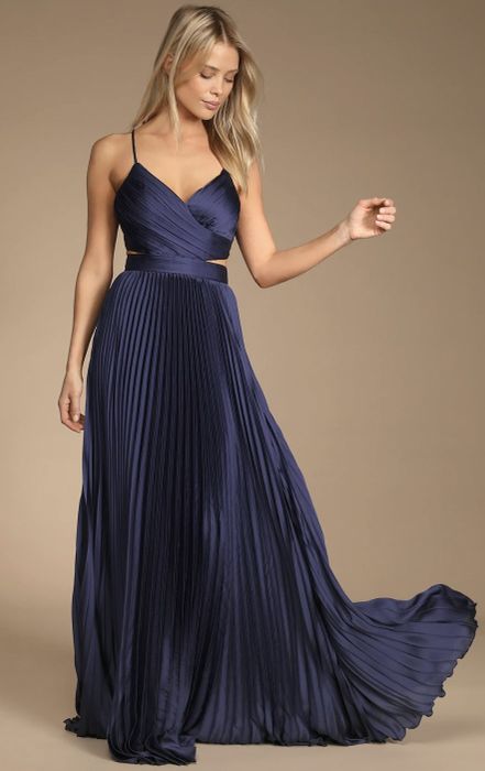 a model showcasing the front view of the dress in navy