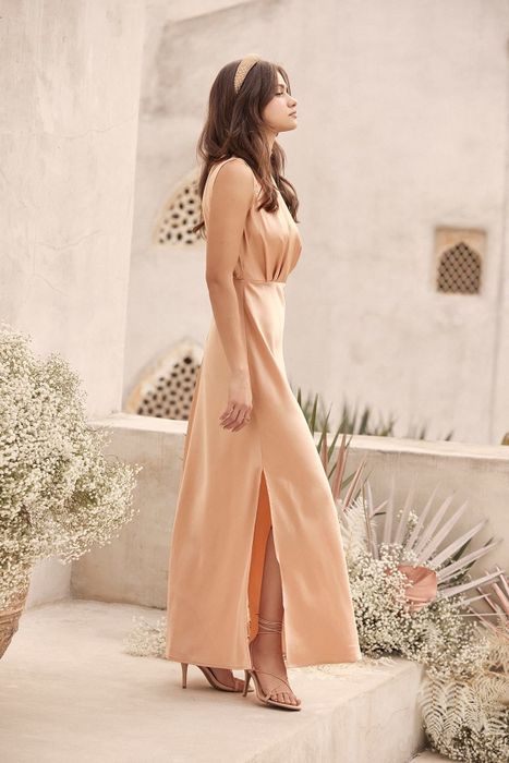 side view of another model wearing this dress in beige
