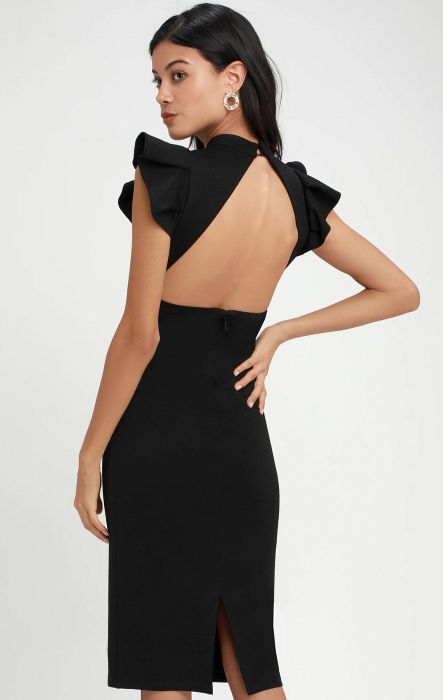 back view of a model wearing the ruffle dress in black