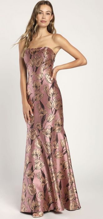 a model wearing the dress in pink and beige hues
