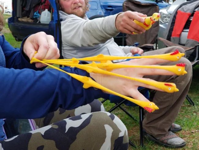 Reviewers showing off the chickens on their fingers, launching them with slingshots.