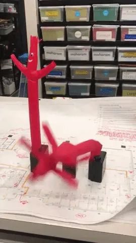 Gif of three mini wacky waving inflatable tube guys flailing about